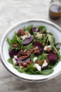 roasted beetroot salad with arugula, feta cheese, toasted pecans with maple balsalmic vinaigrette