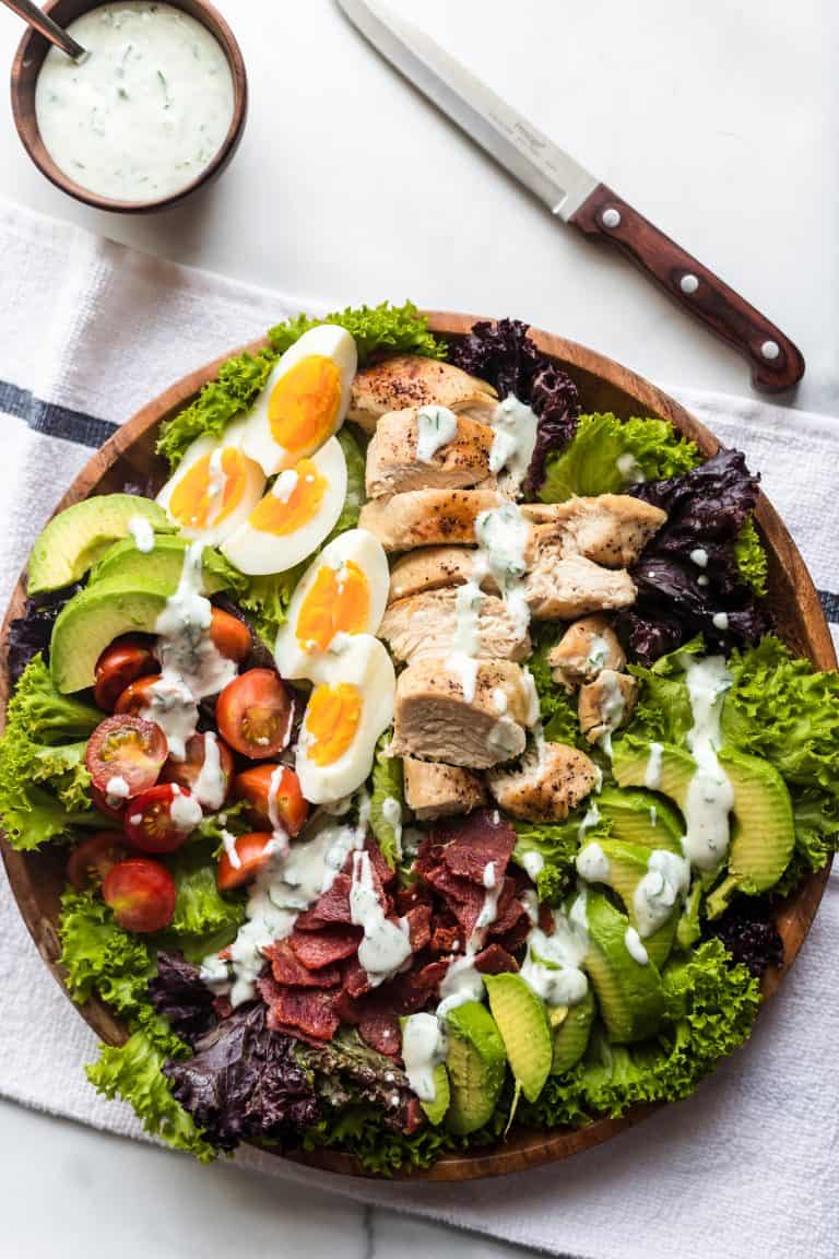 Halal chicken Cobb salad with hard-boiled egg bacon avocado blue cheese for hearty cold lunch