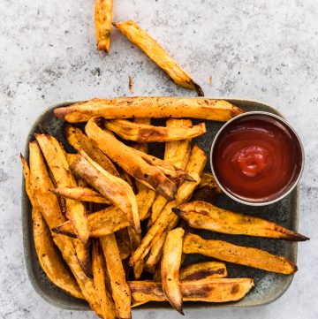 Air Fryer Sweet Potato Fries on grey plate with ketchup
