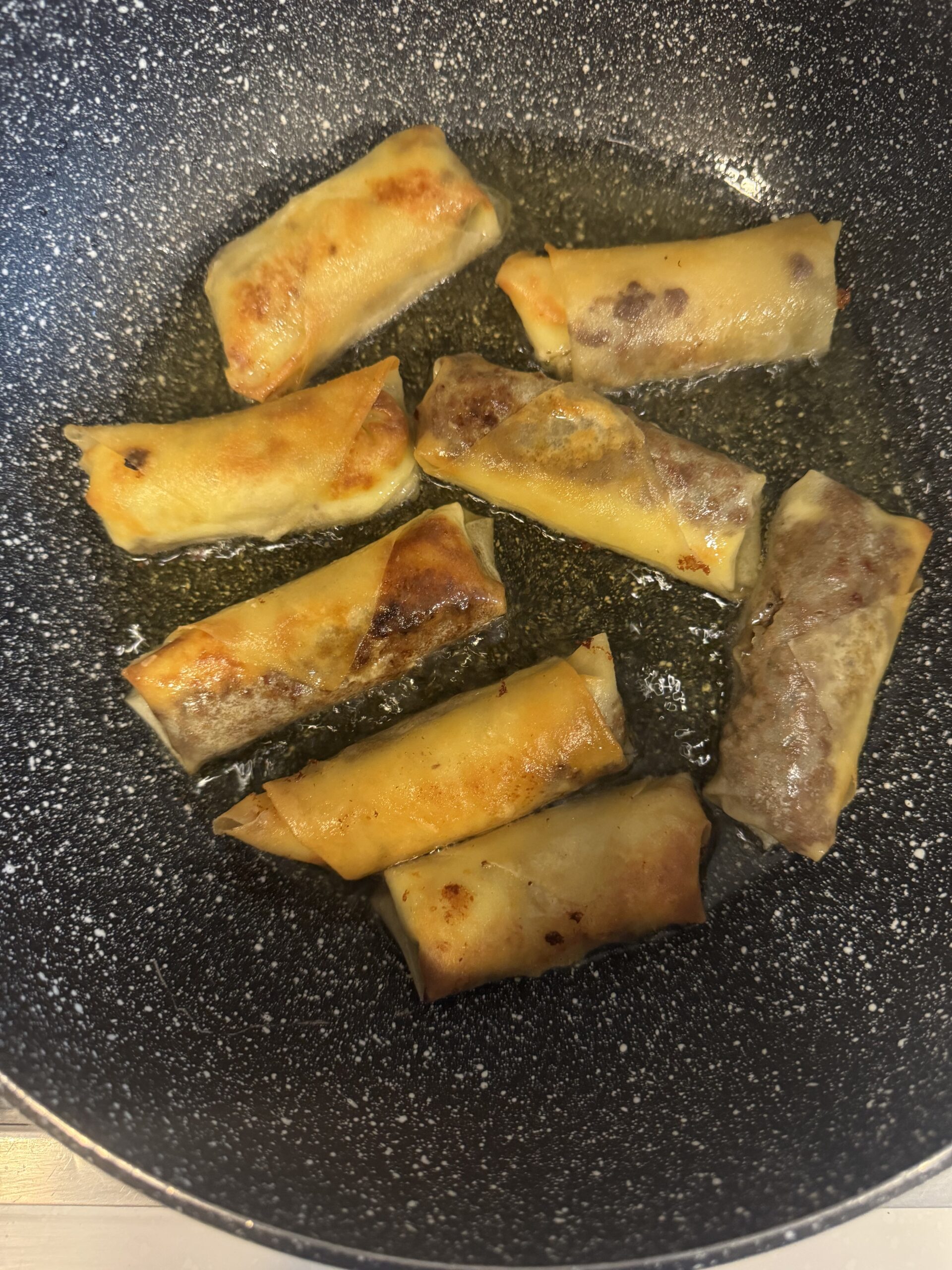 spring rolls fried until golden brown in hot oil.