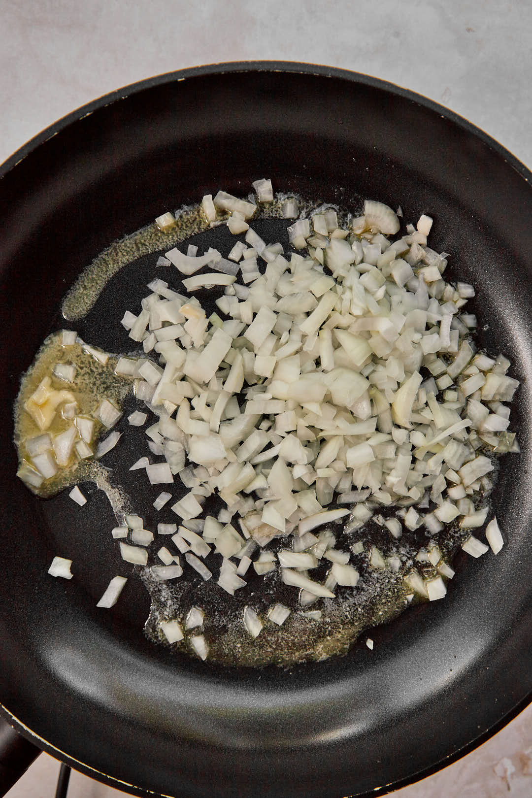 diced onion in a large skillet with melted butter.