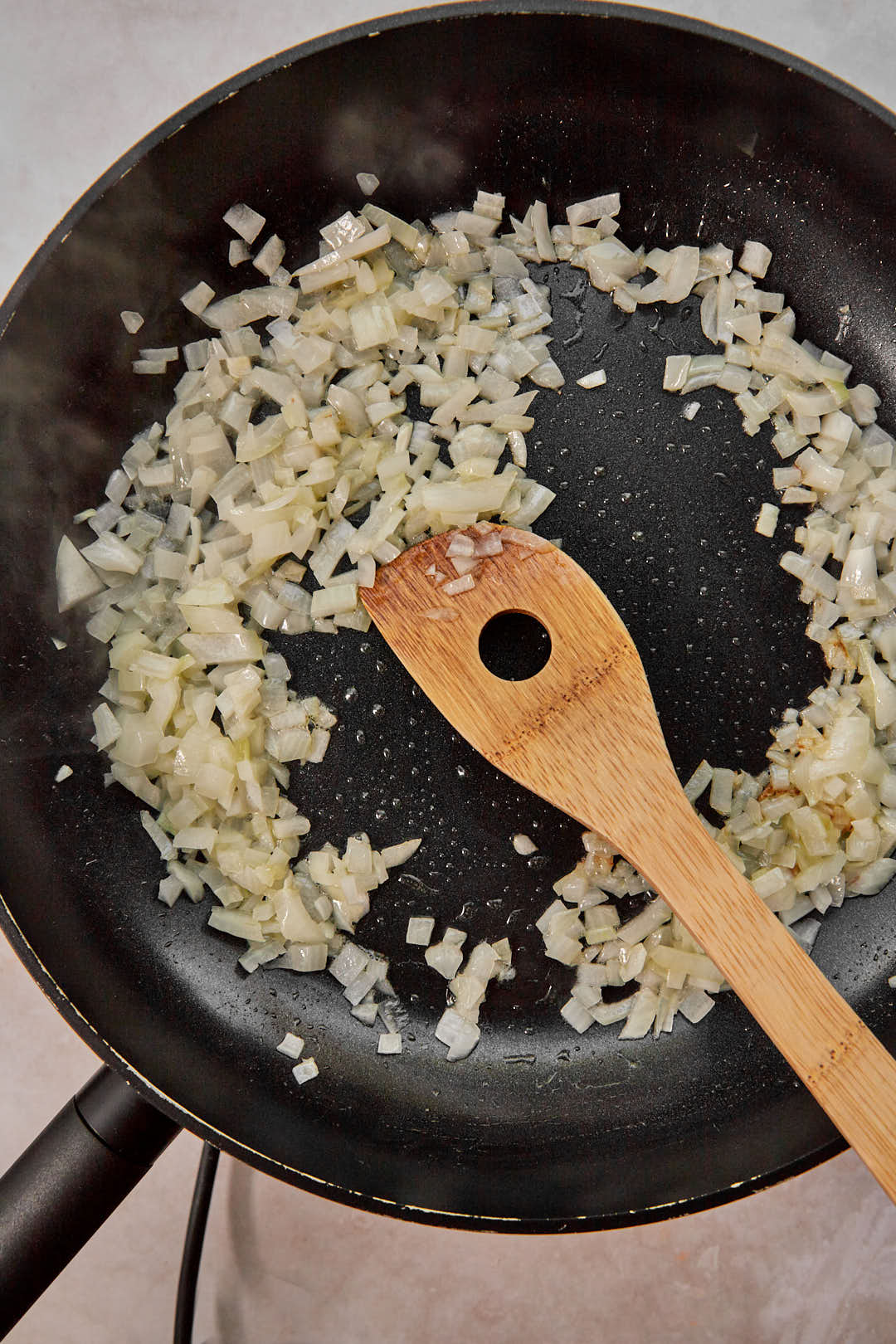 diced cooked onions in a large skillet with melted butter.
