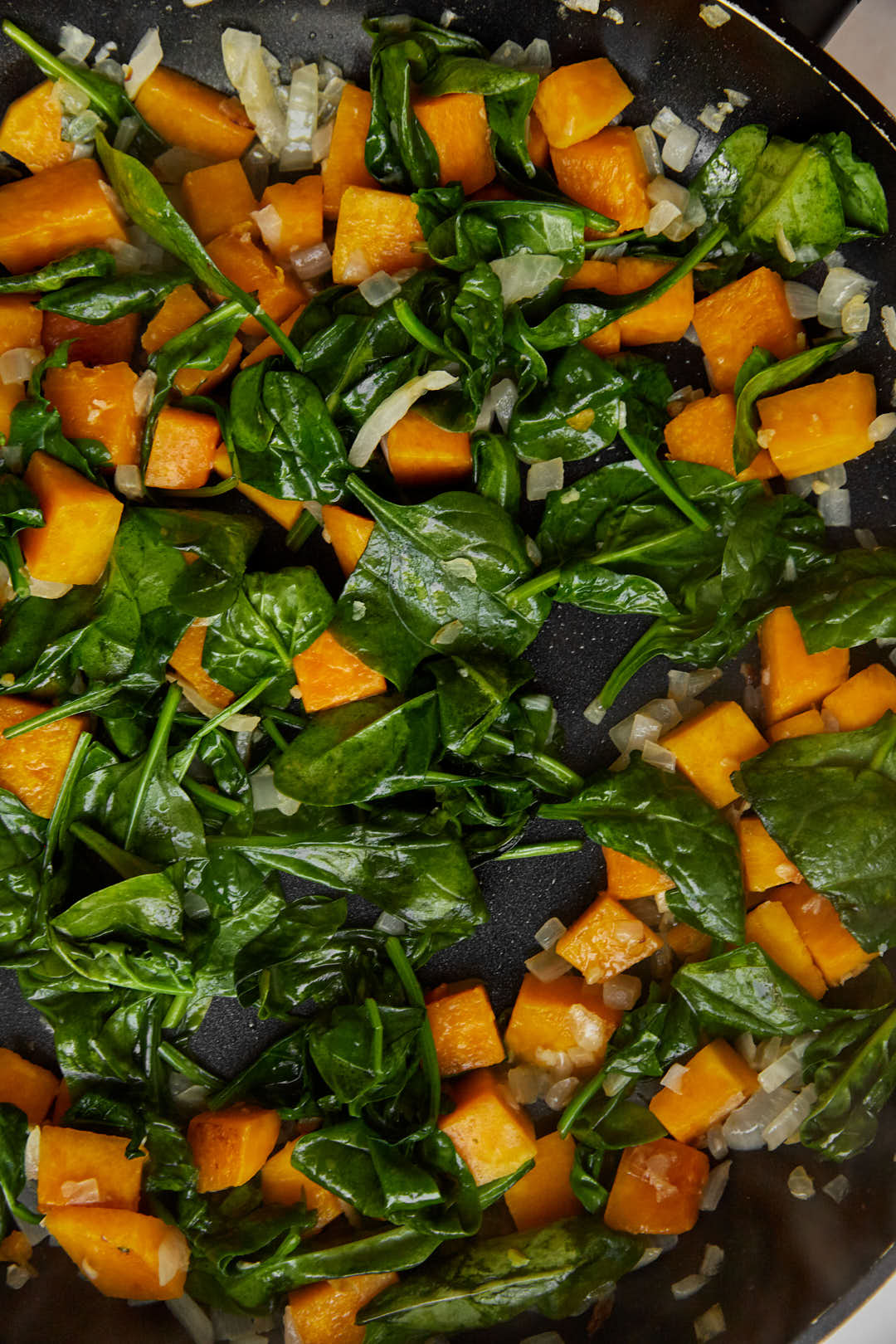 Cook until the baby spinach is wilted.
