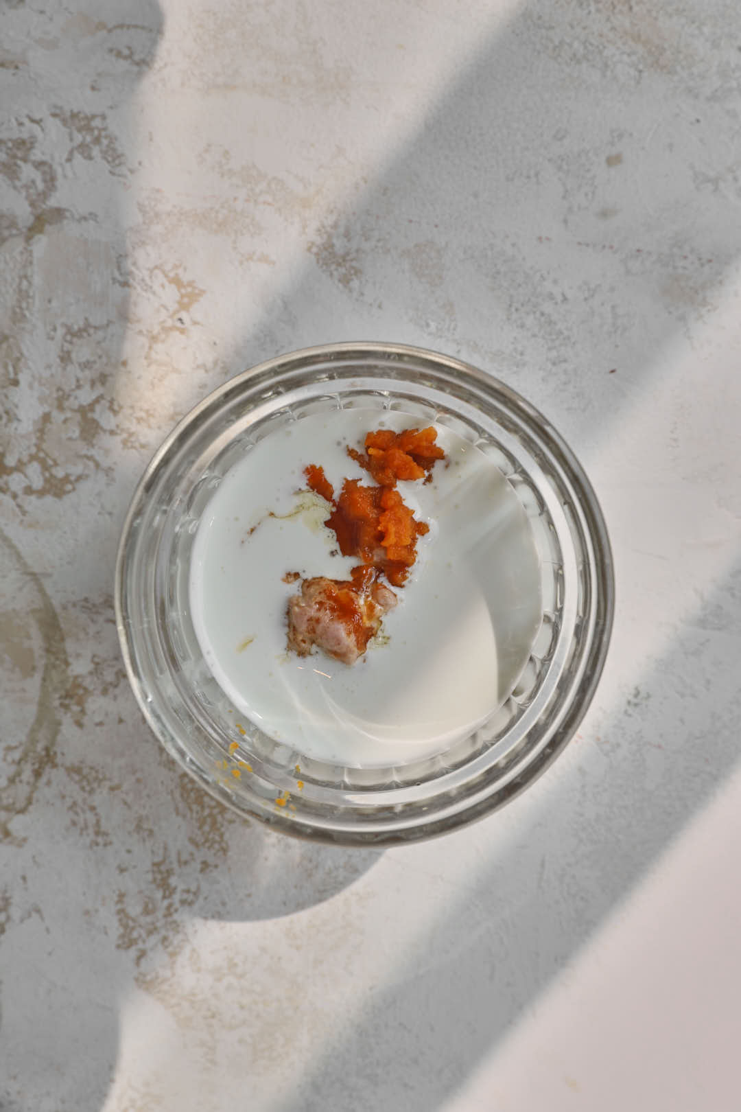 ingredients for pumpkin cold foam in a glass ramekin.