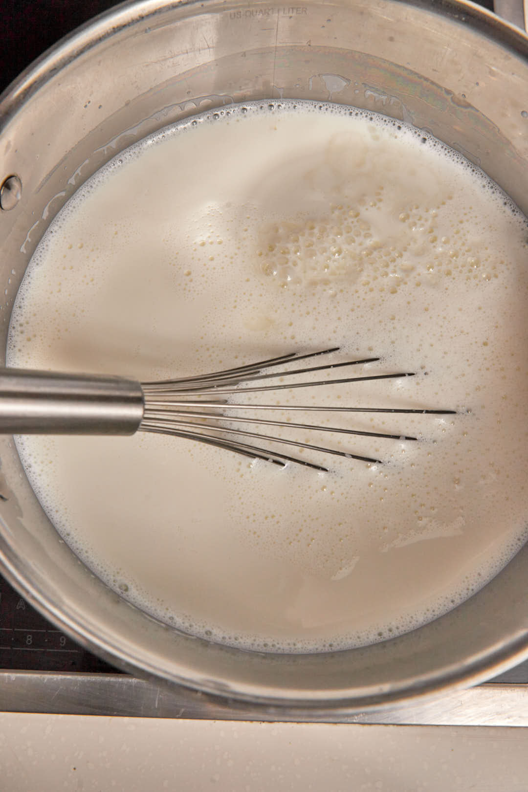 white vinegar and whole milk in a large saucepan with a wire whisk.