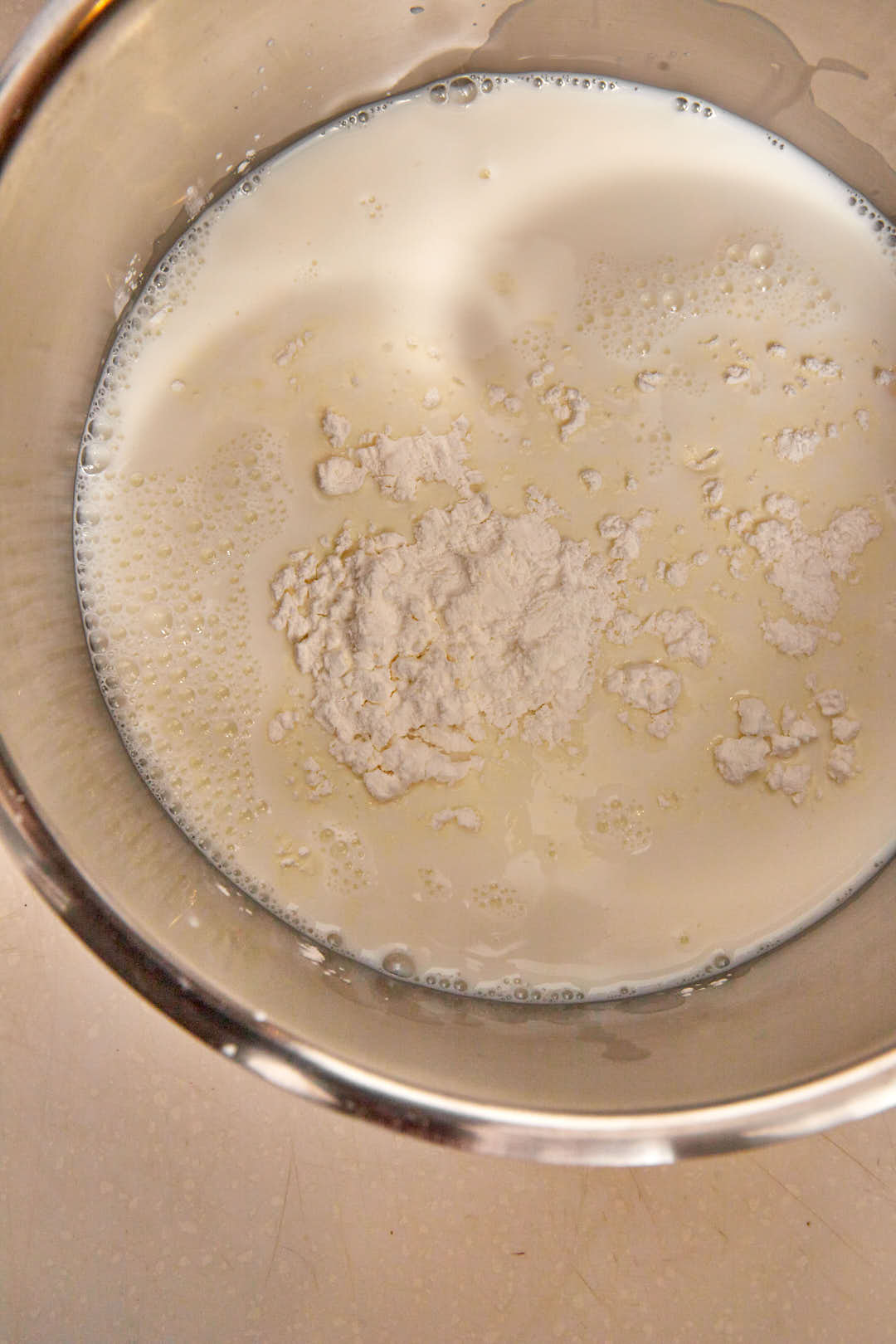 Millk and cornstarch added to a saucepan.
