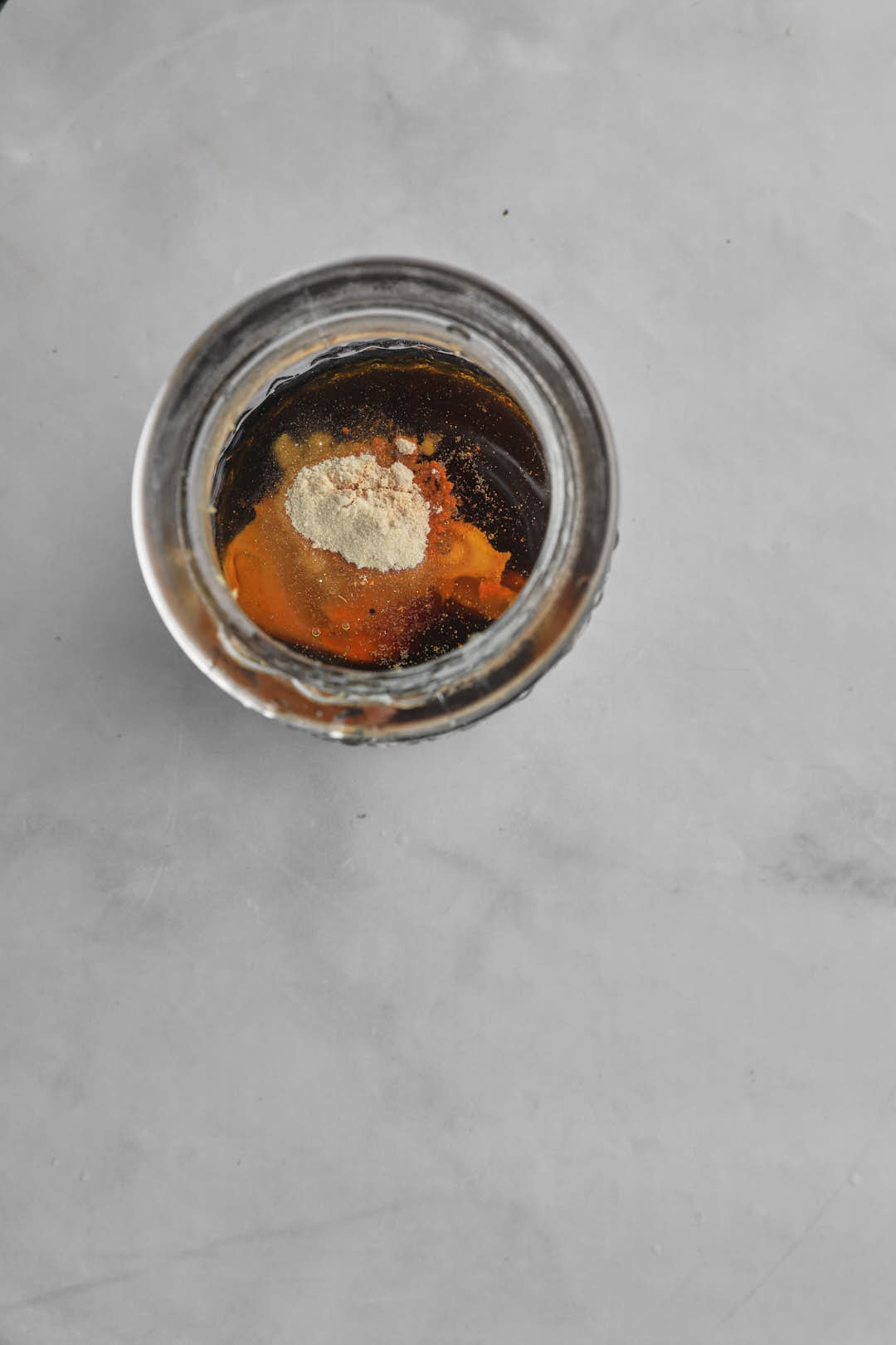 ingredients to make salad dressing in a jar.