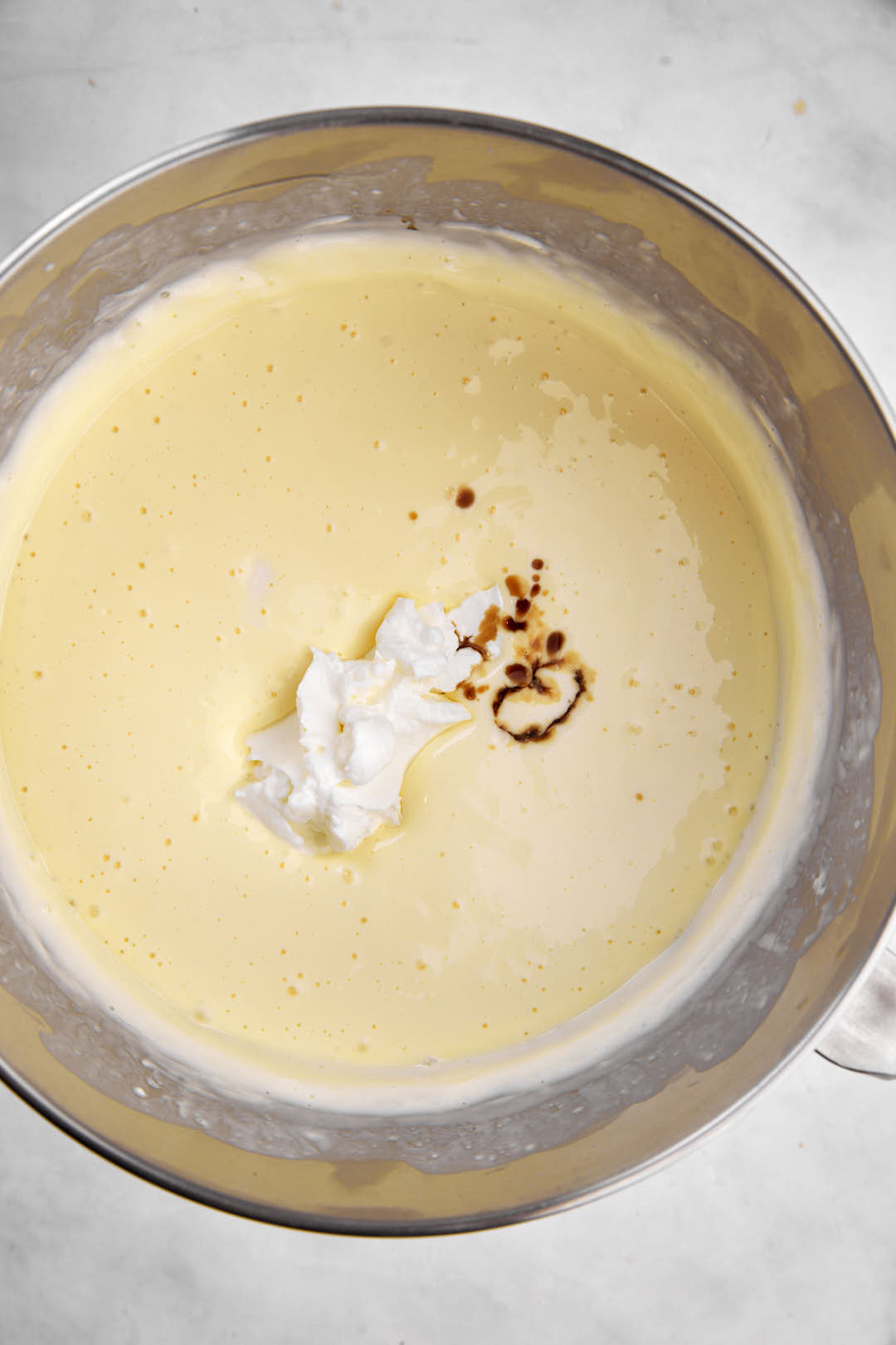 sour cream and vanilla in cheeseake batter.