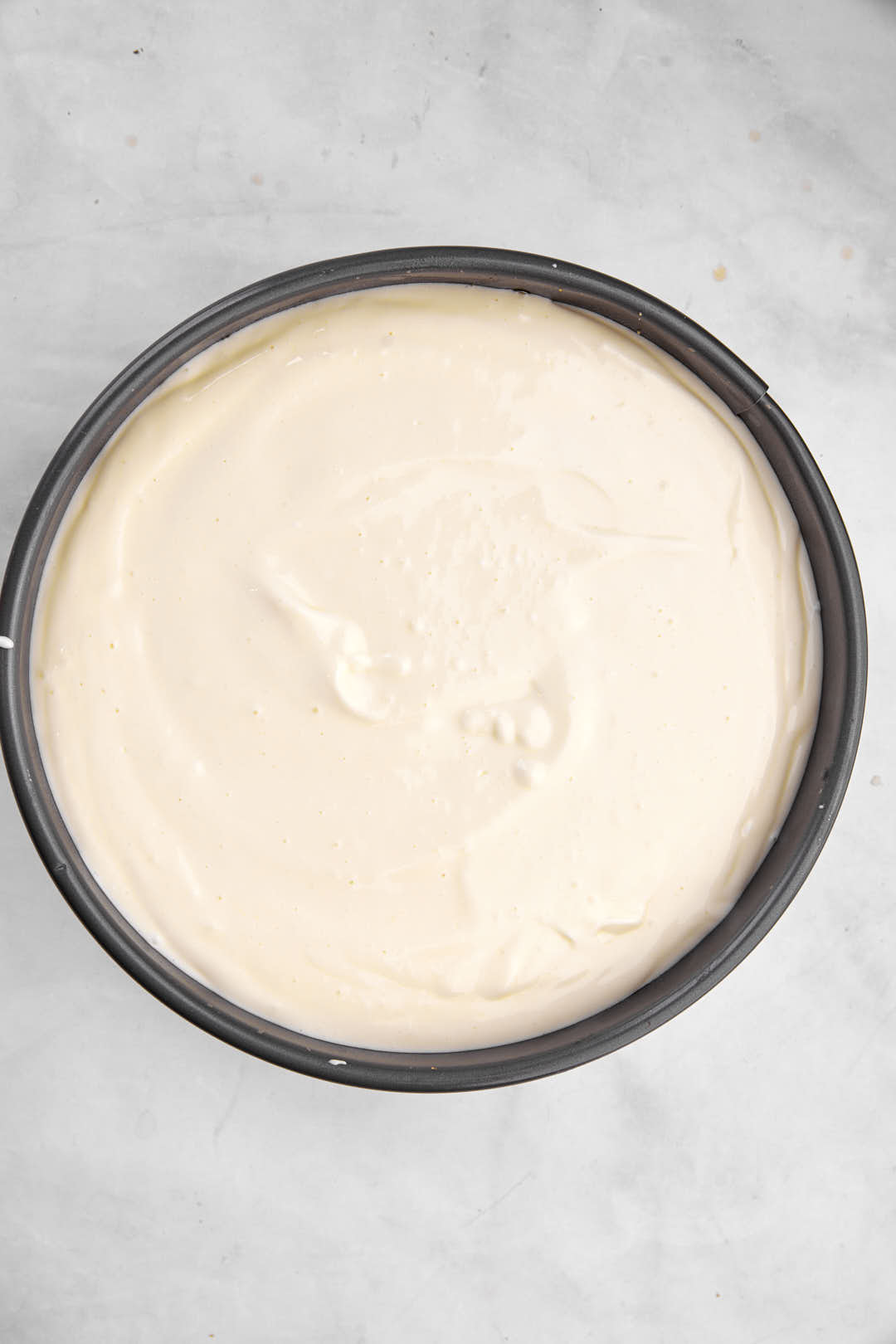 cheesecake filling in springform pan.