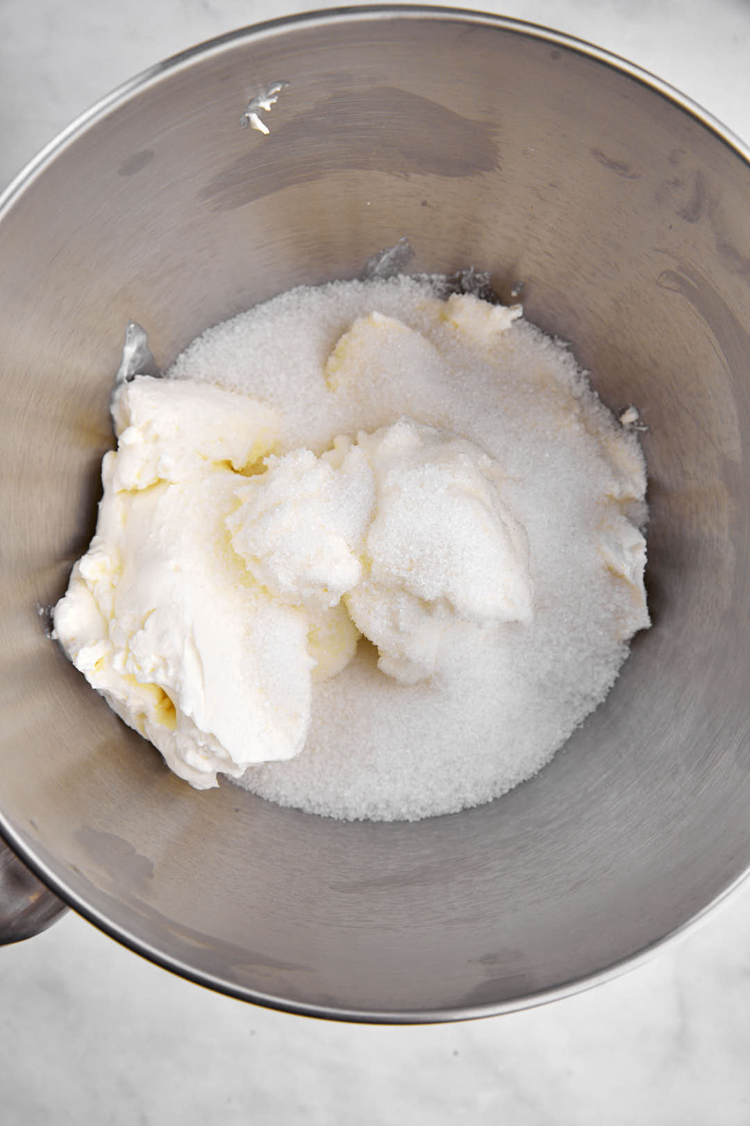 cream cheese and sugar in mixing bowl
