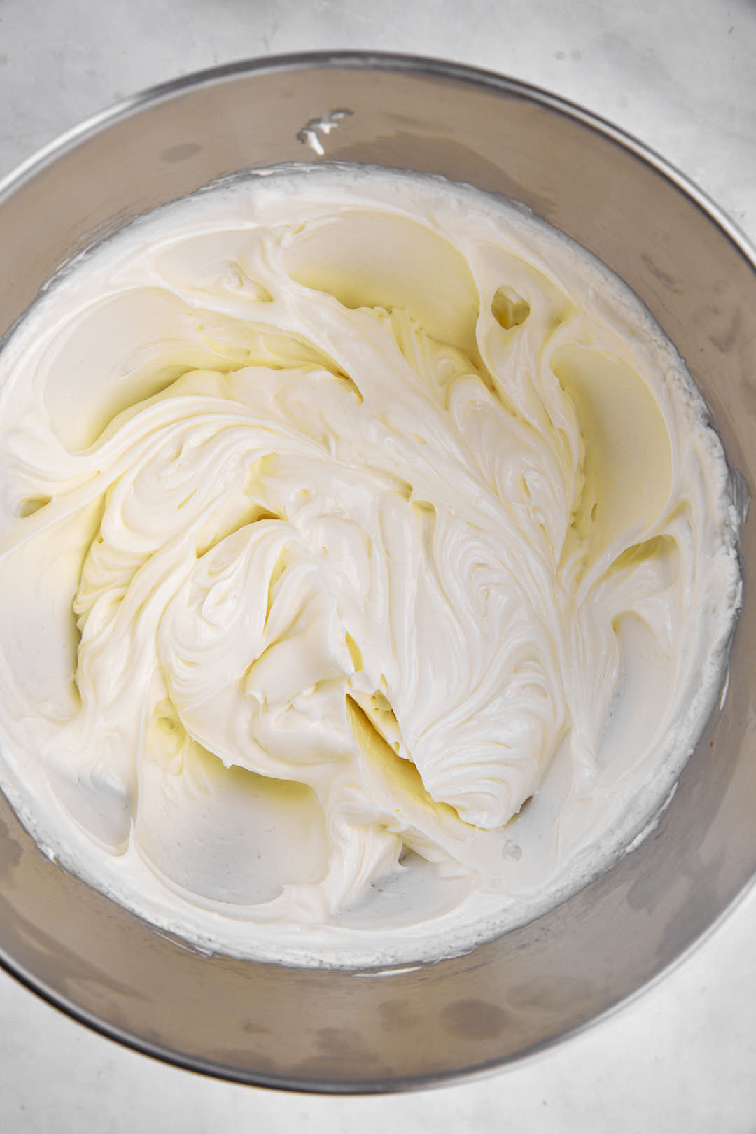 cream cheese and sugar mixed together until fluffy in mixing bowl.