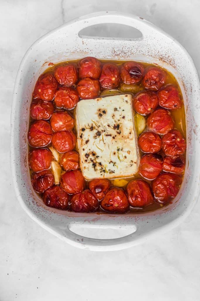 baked feta cheese block on cherry tomatoes