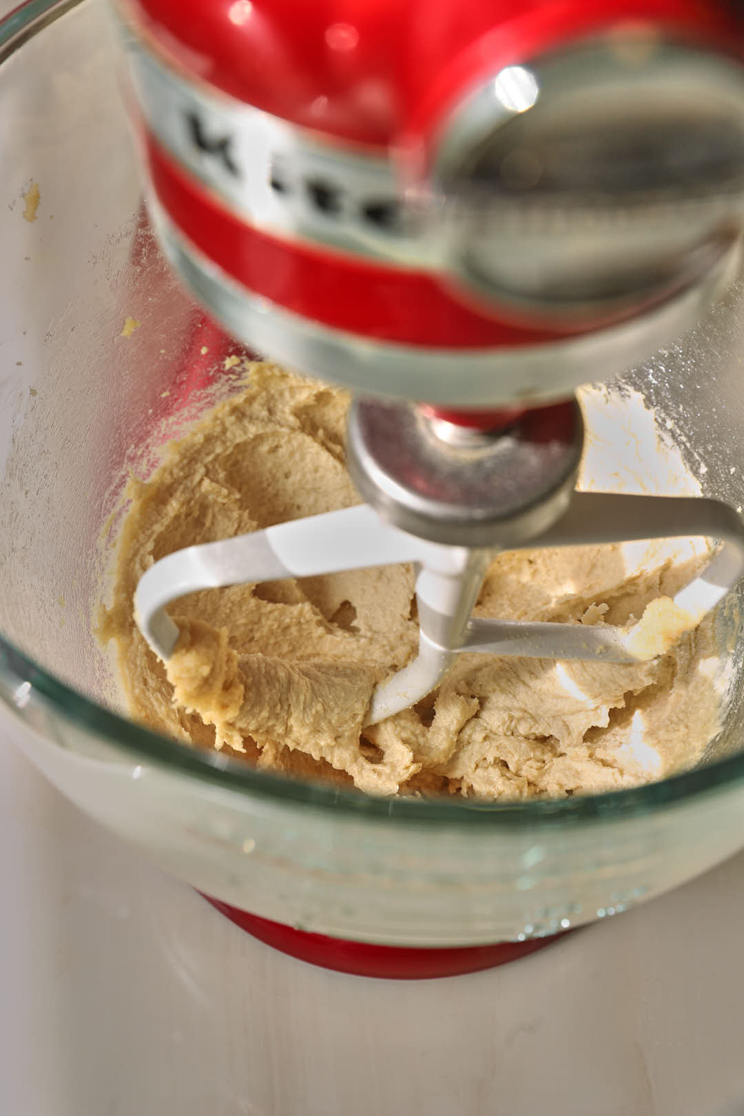butter and sugar creamed together in glass bowl of stand mixer.