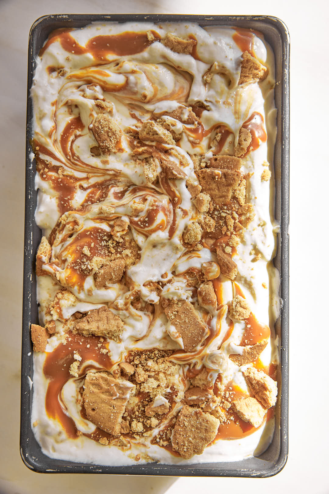 banoffee ice cream in a loaf pan after freezing.