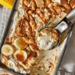 banoffee ice cream in a loaf pan with an ice cream scoop.