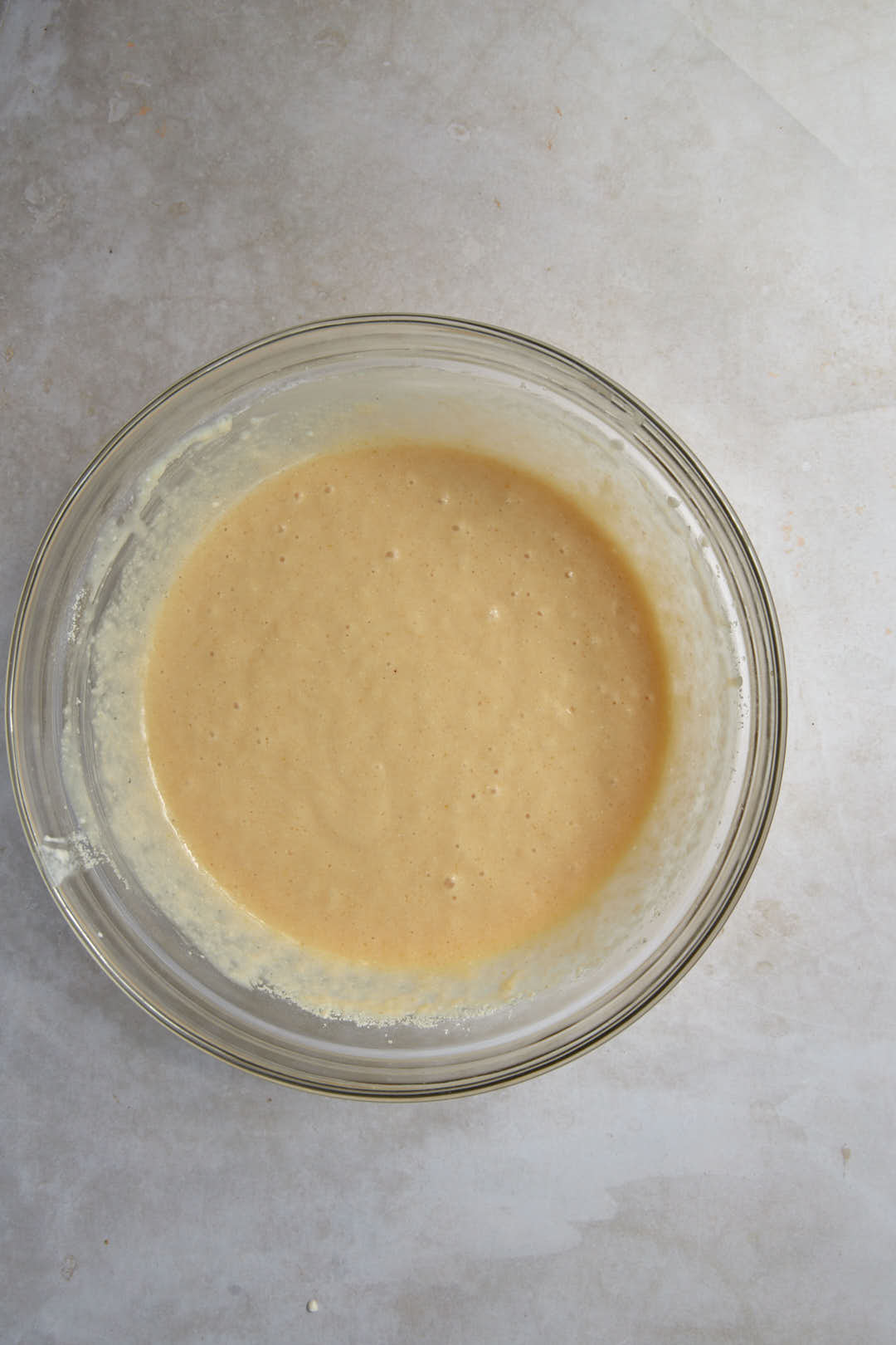 basbousa batter in a glass bowl.