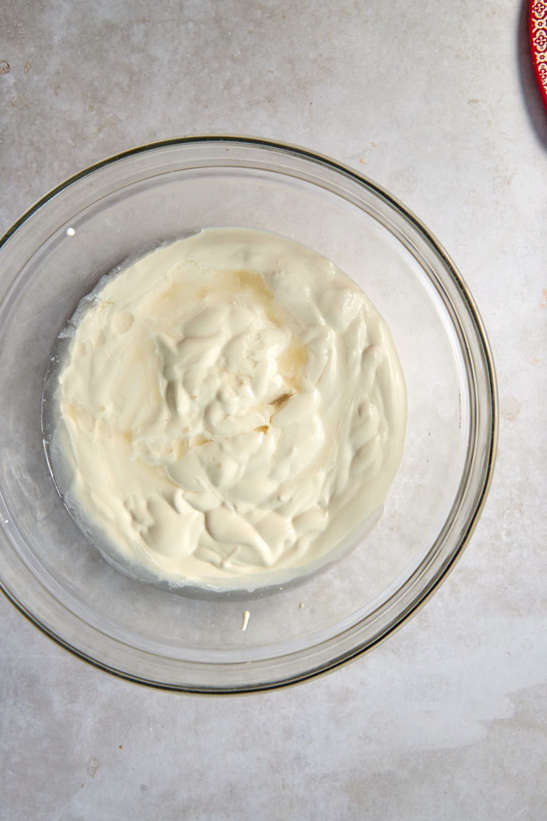 cream and rose water in a glass bowl.