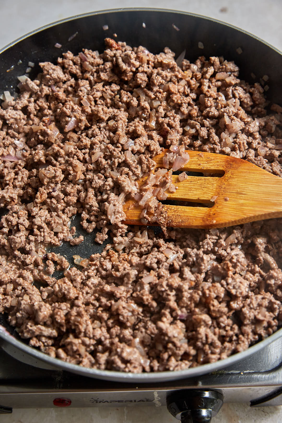 cooked seasoned ground beef in a large skillet.