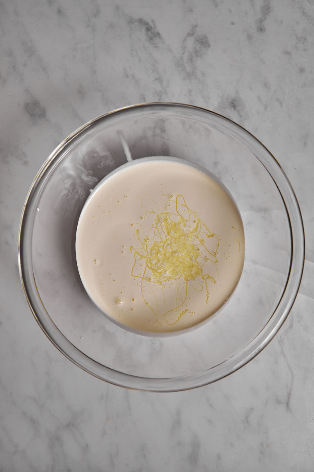 condensed milk and lemon juice in a glass bowl.
