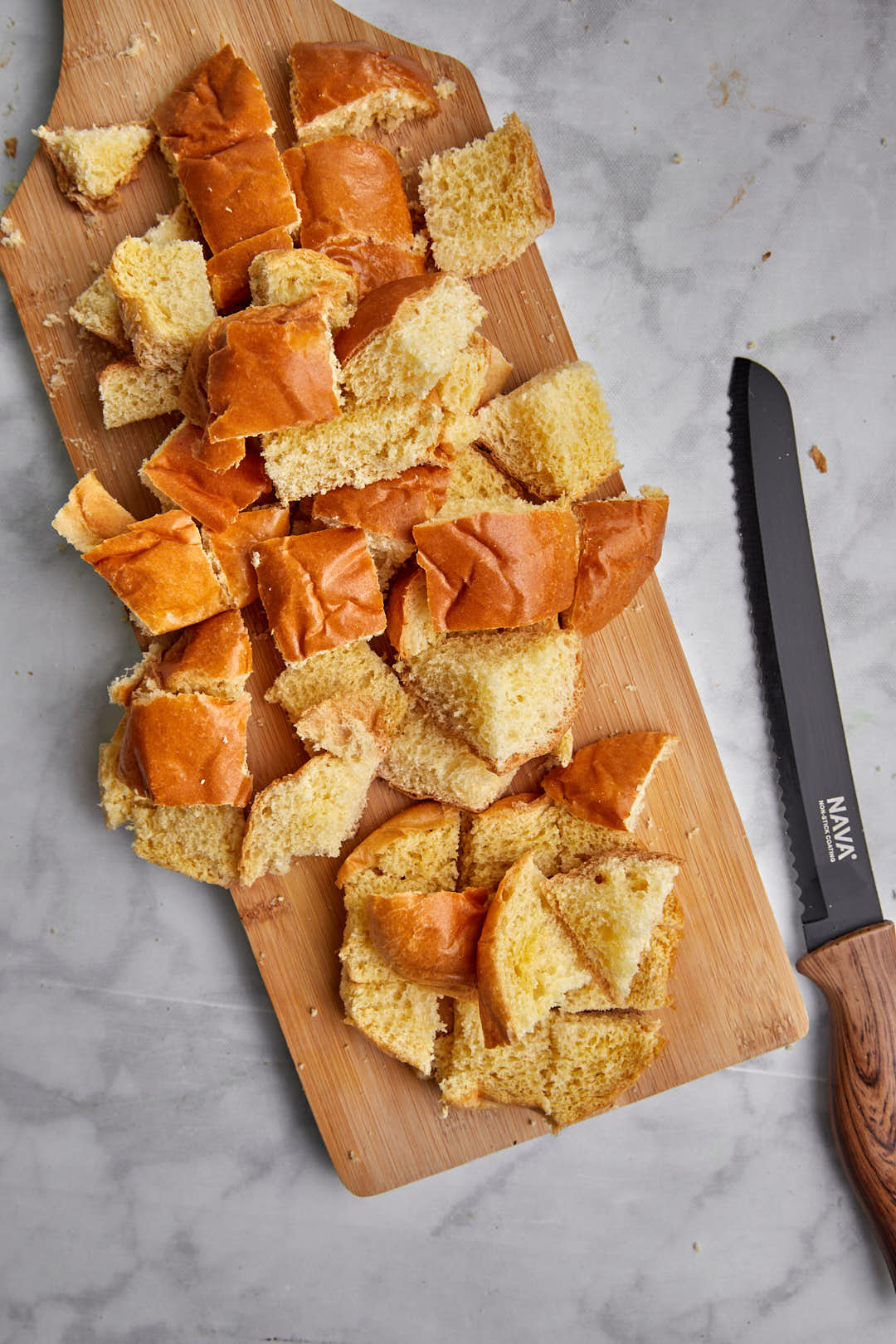 Roughly chop up the brioche burger buns into cubes.