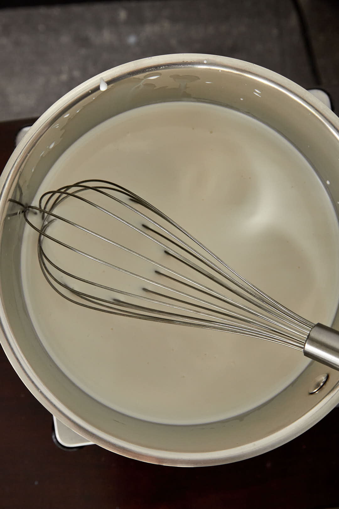 milk and heavy cream in a medium saucepan with a whisk.