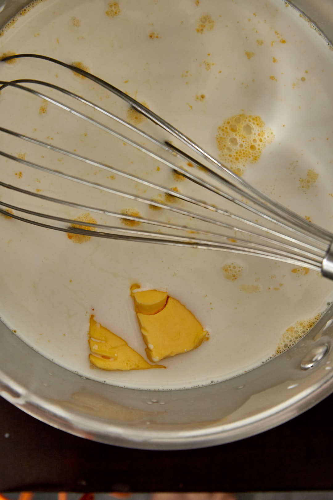 softened butter added to heavy cream and milk in a saucepan.