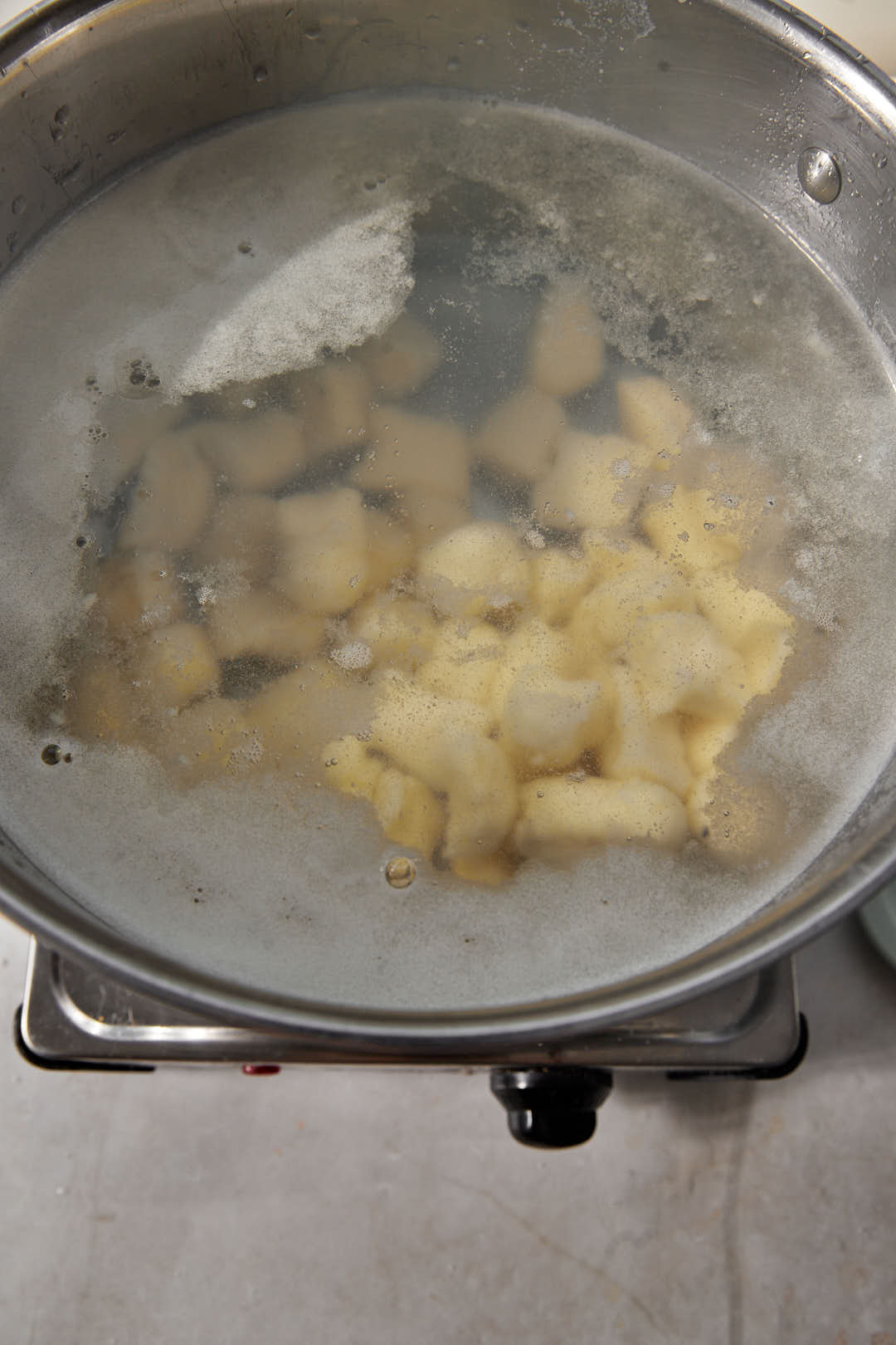 gnocchi added to a large pot of boiling water.