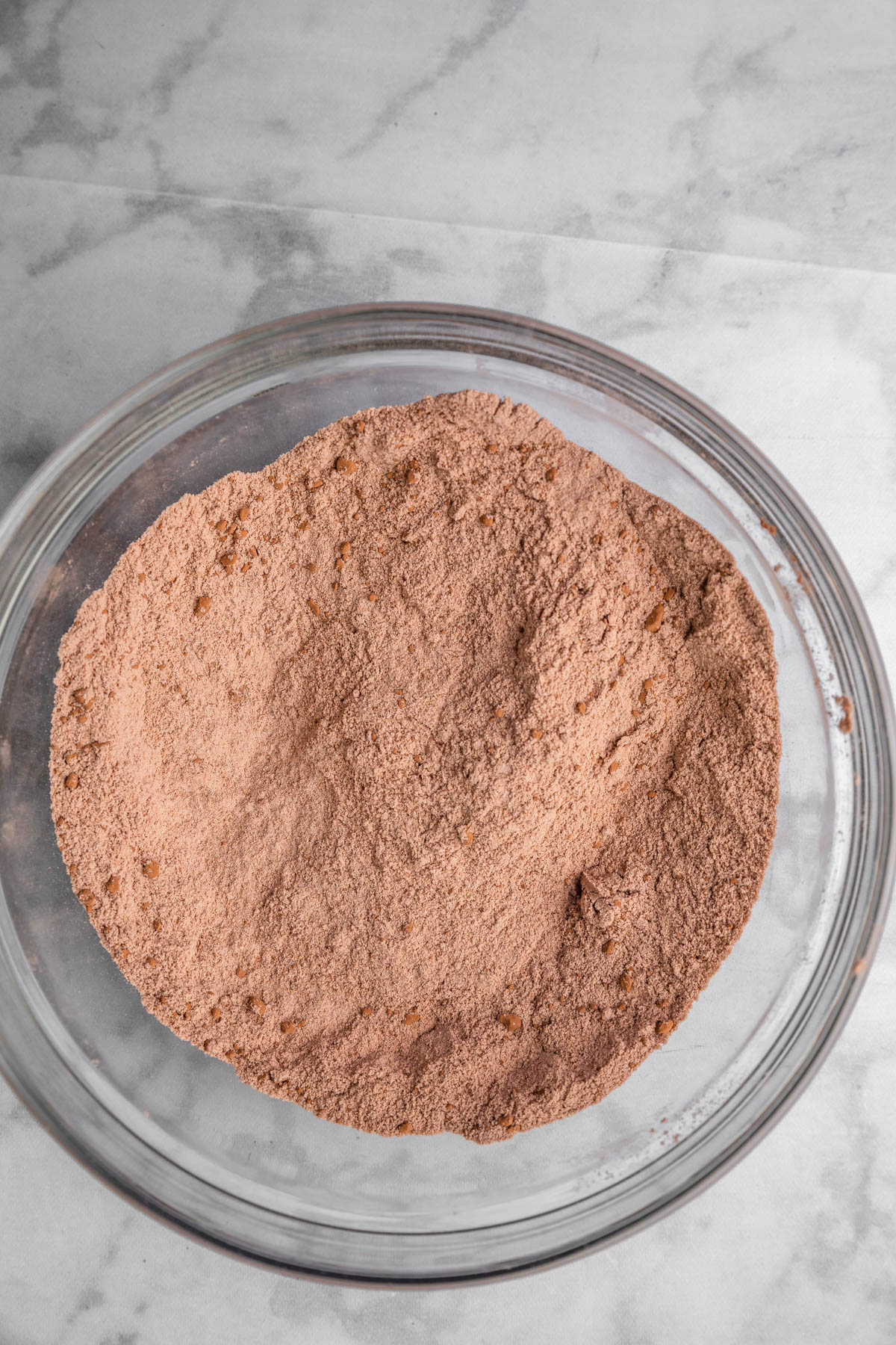 whisked cocoa powder and flour in a glass bowl.