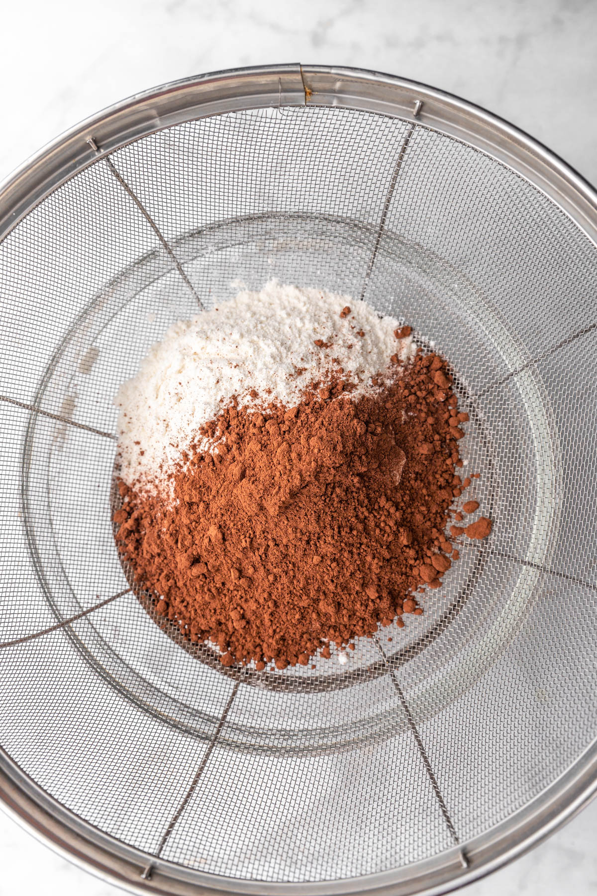 dry ingredients for brownie cookies in a sifter.