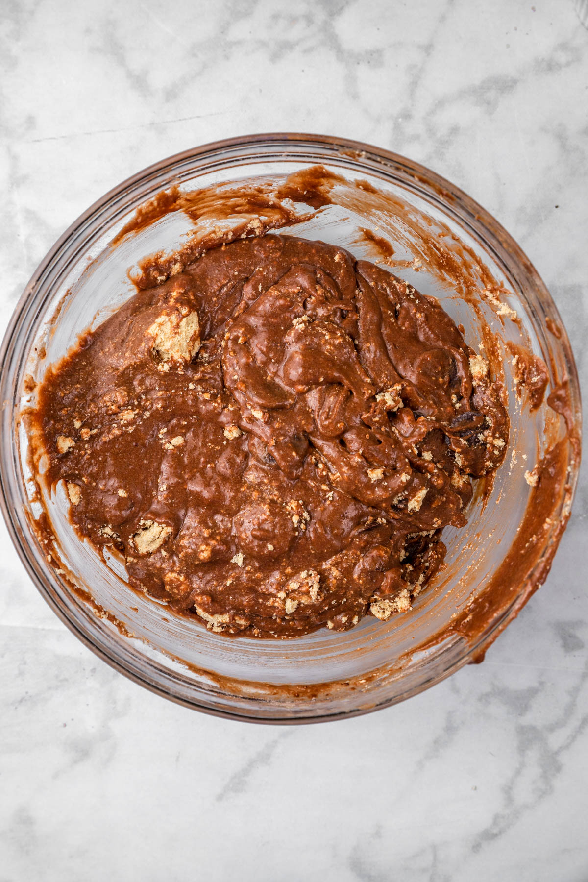 Mixed chocolate cake halva batter in a glass bowl.