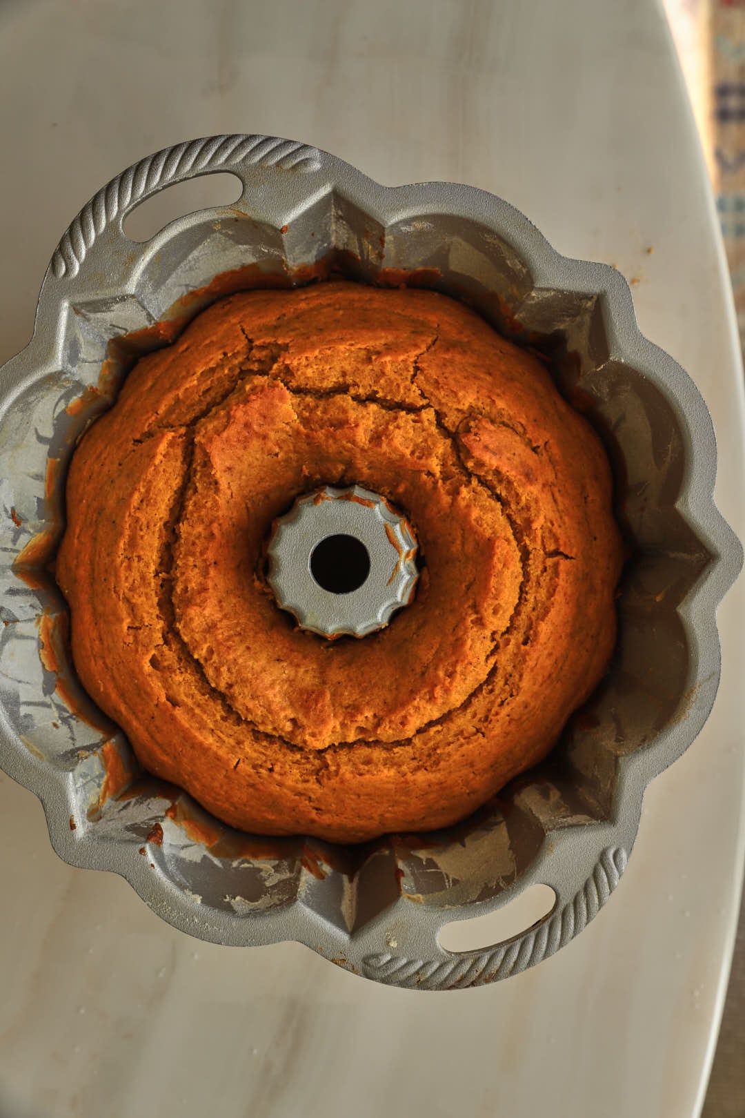 baked pumpkin bundt cake in bundt cake pan.