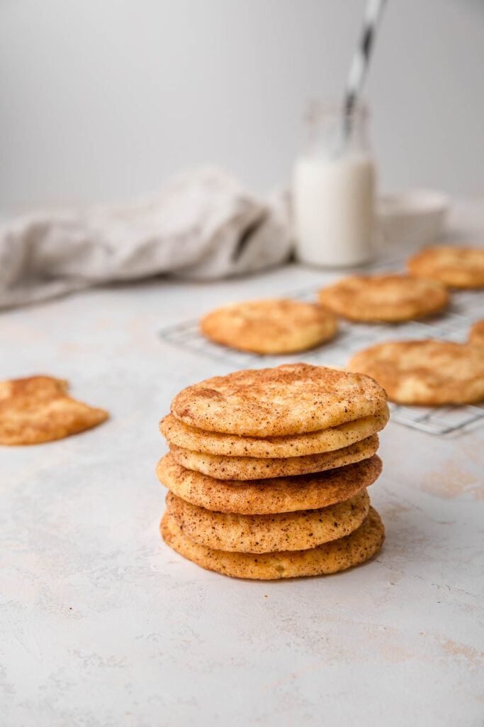 stack of cardamom snickerdoodles on white background.