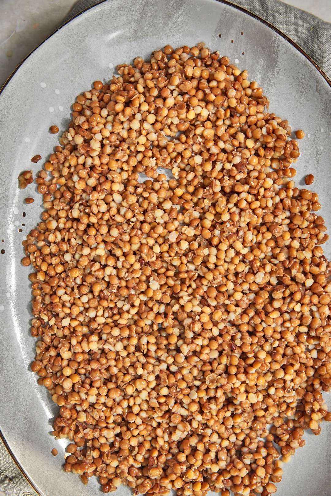 lentils in the base of a serving dish.