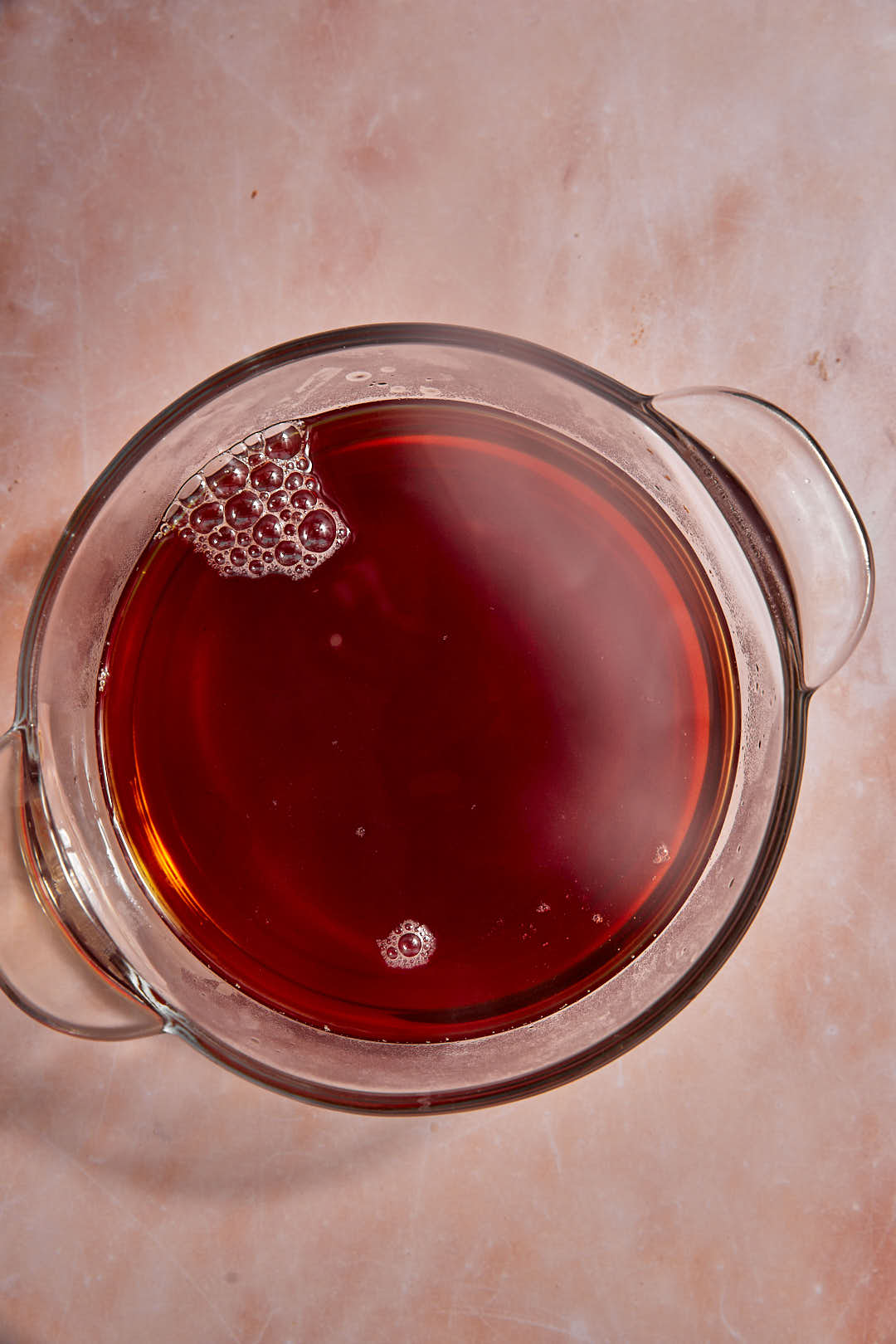 steeped masala tea in a small bowl.