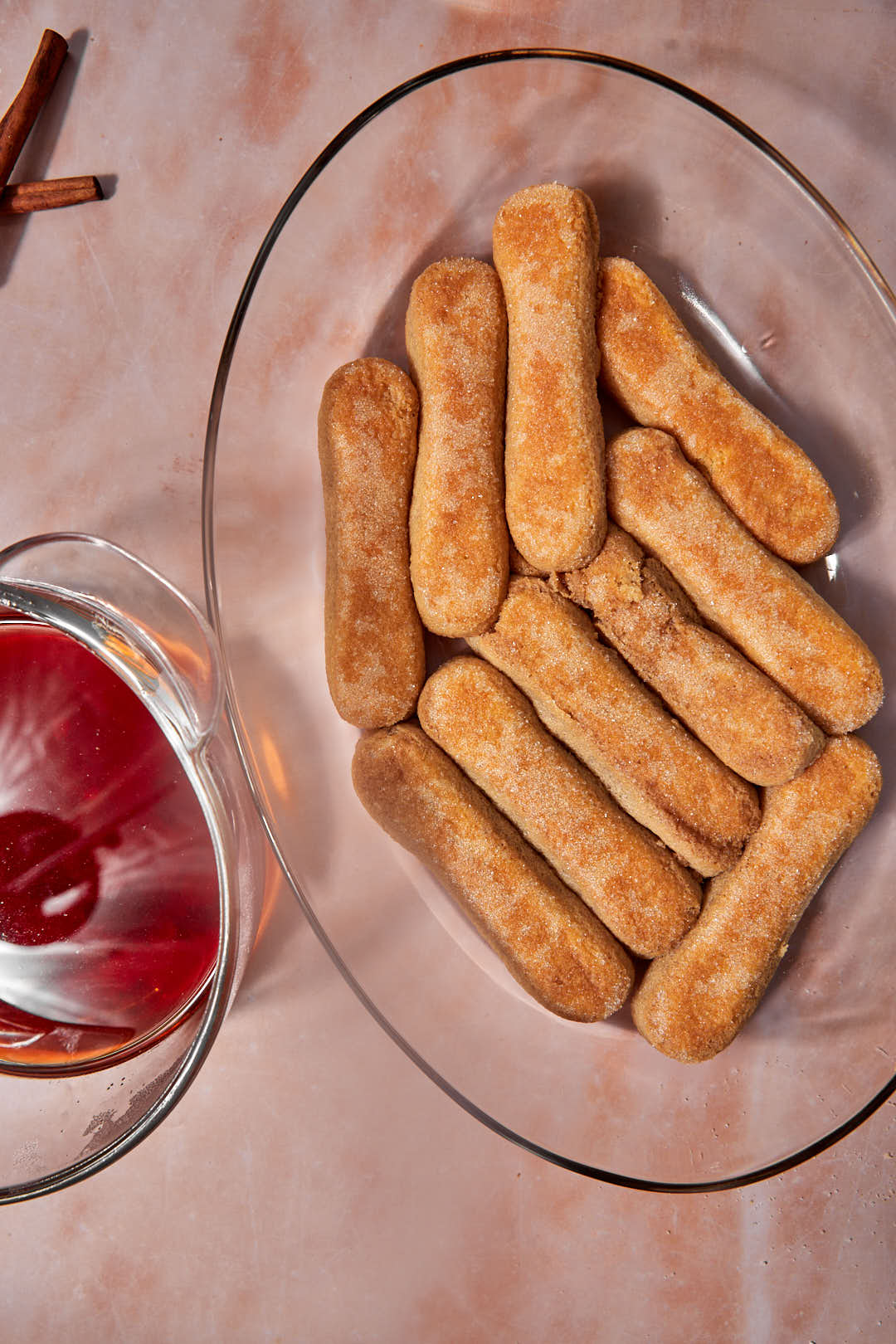 ladyfingers dipped in masala chai in pyrex baking dish.
