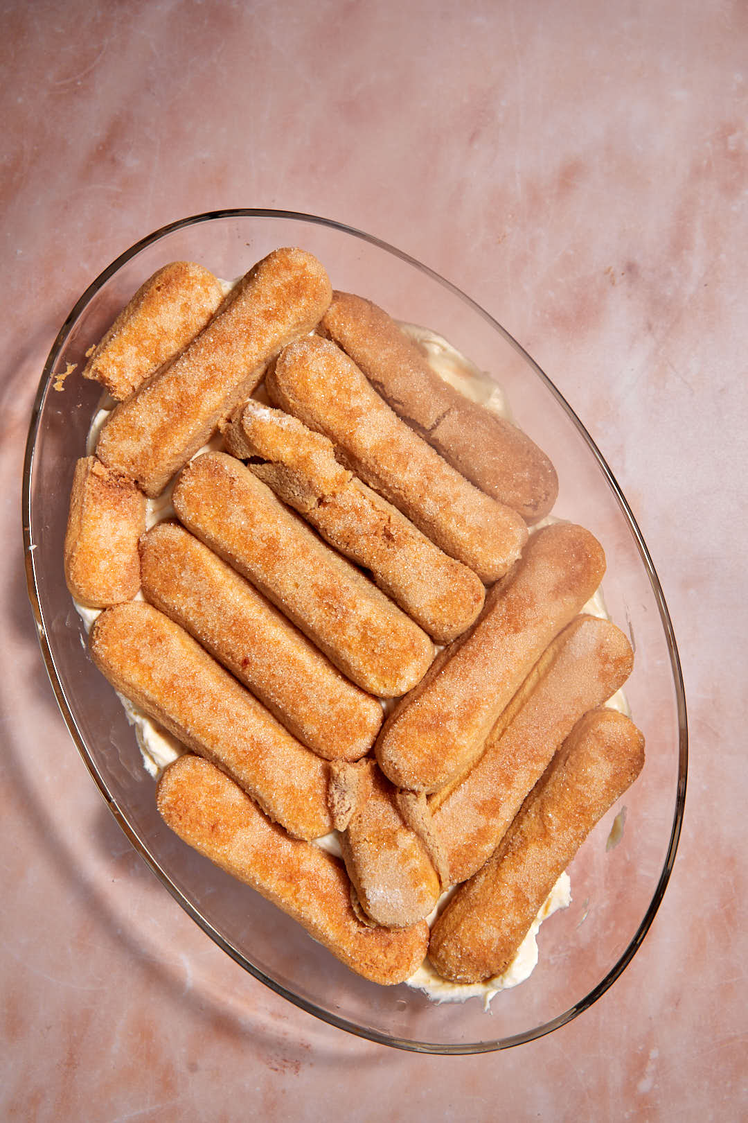second layer of soaked ladyfingers in pyrex dish.