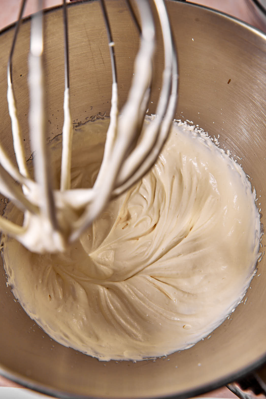 whipped cream in steel mixer bowl.