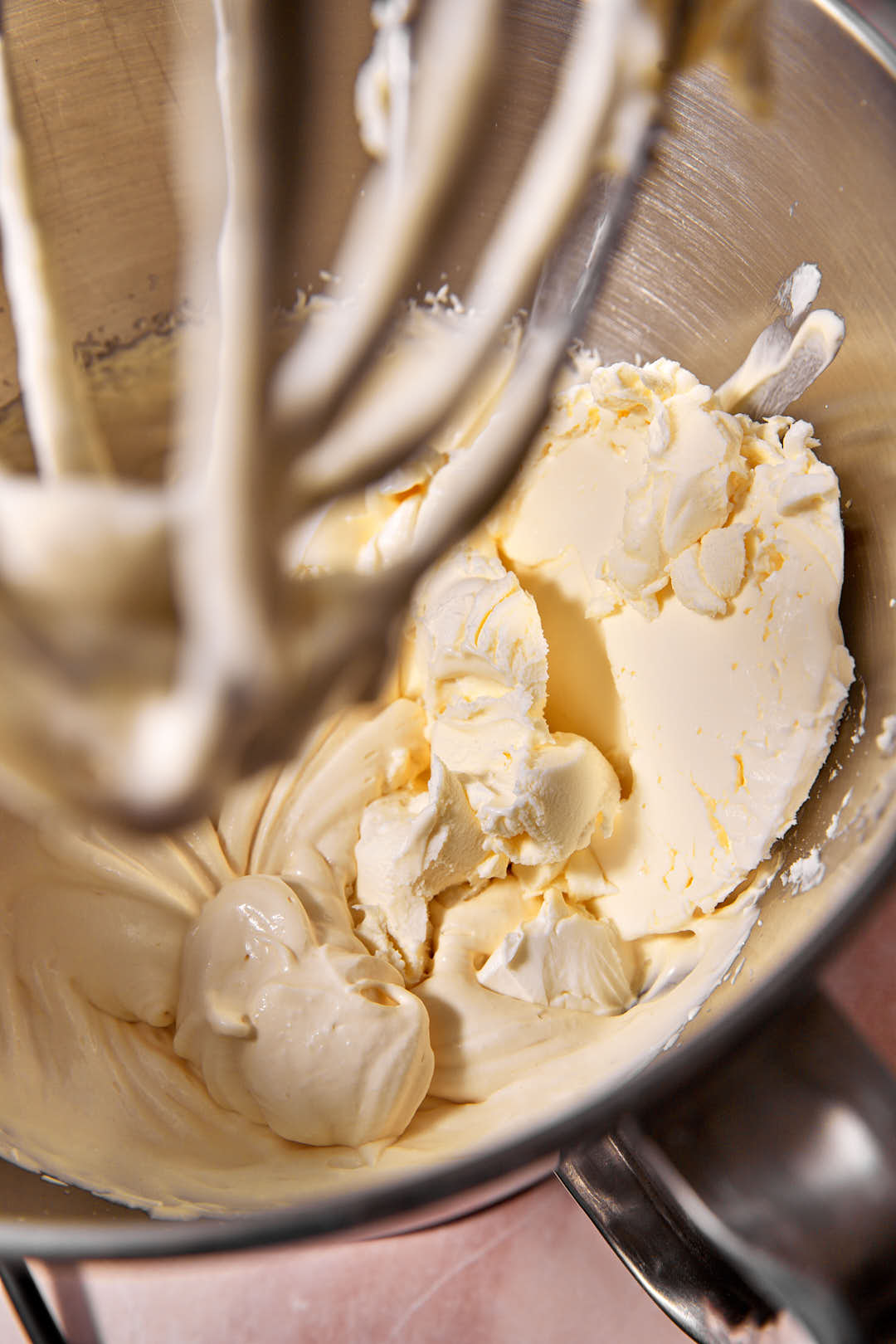 mascarpone cream added to whipped cream ina. bowol