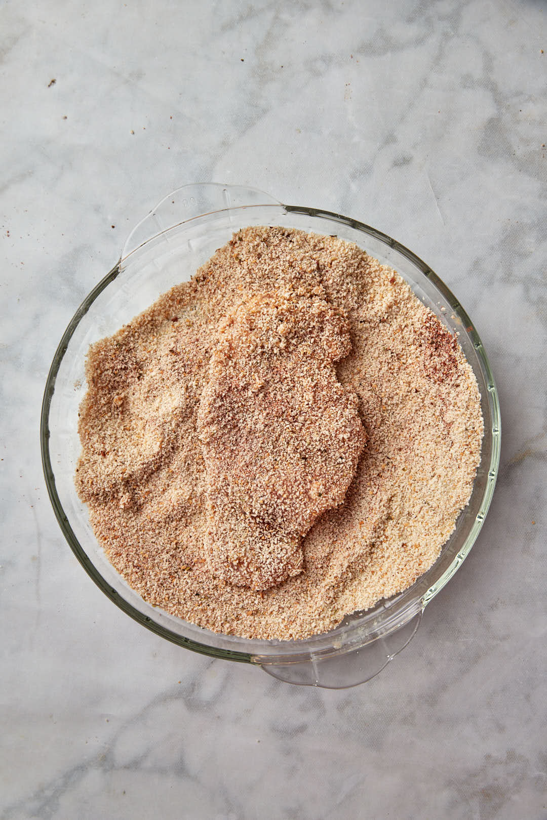 chicken breast coated in breadcrumbs.