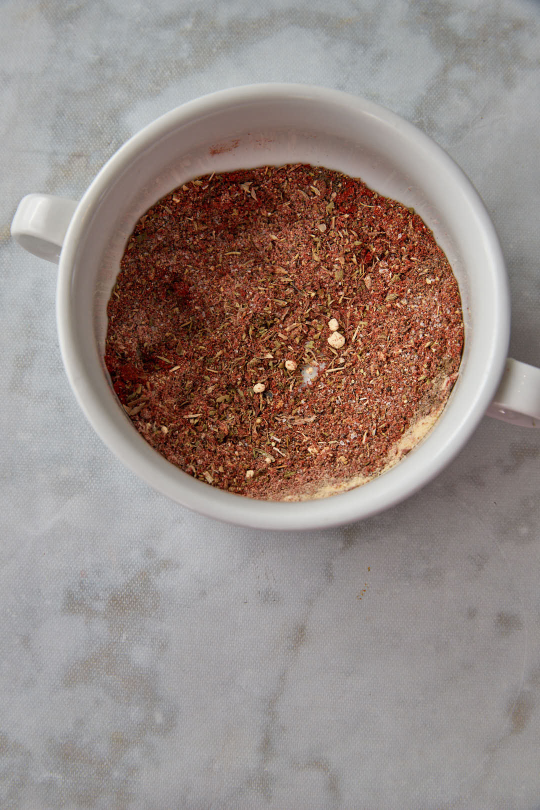 spice mixture in white bowl after mixing.