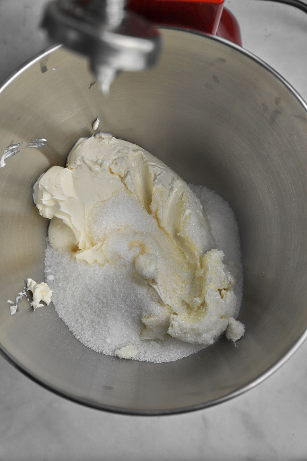 softened cream cheese and sugar added to the bowl of a stand mixer.
