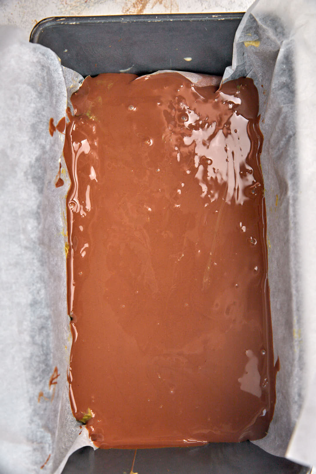 second layer of melted chocolate in loaf pan