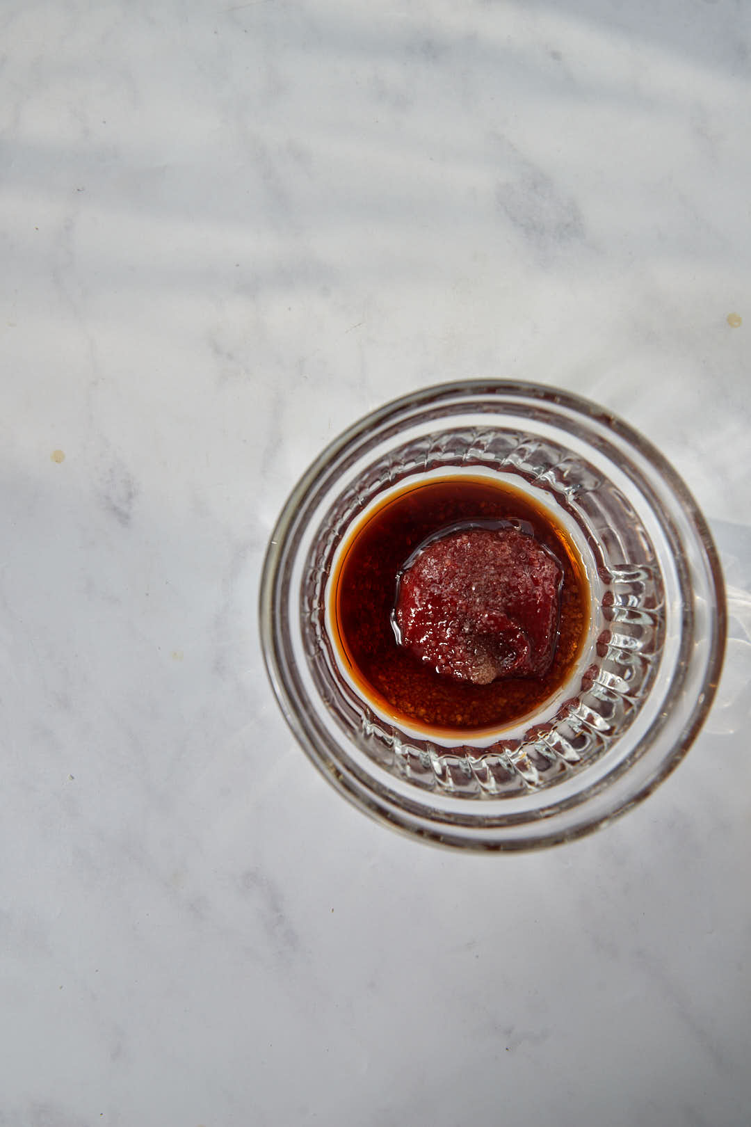 gochujang, soy sauce and sugar in a small glass ramekin.