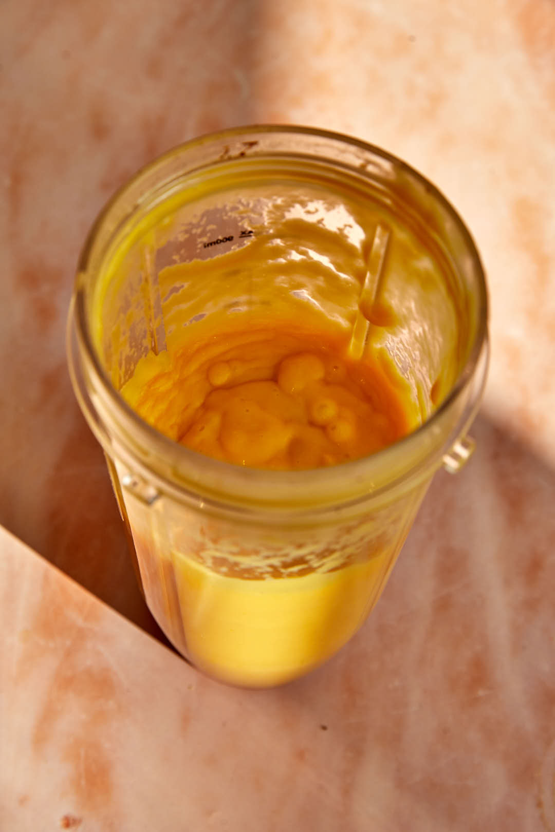 creamy mango base for sago in a portable blender bullet.