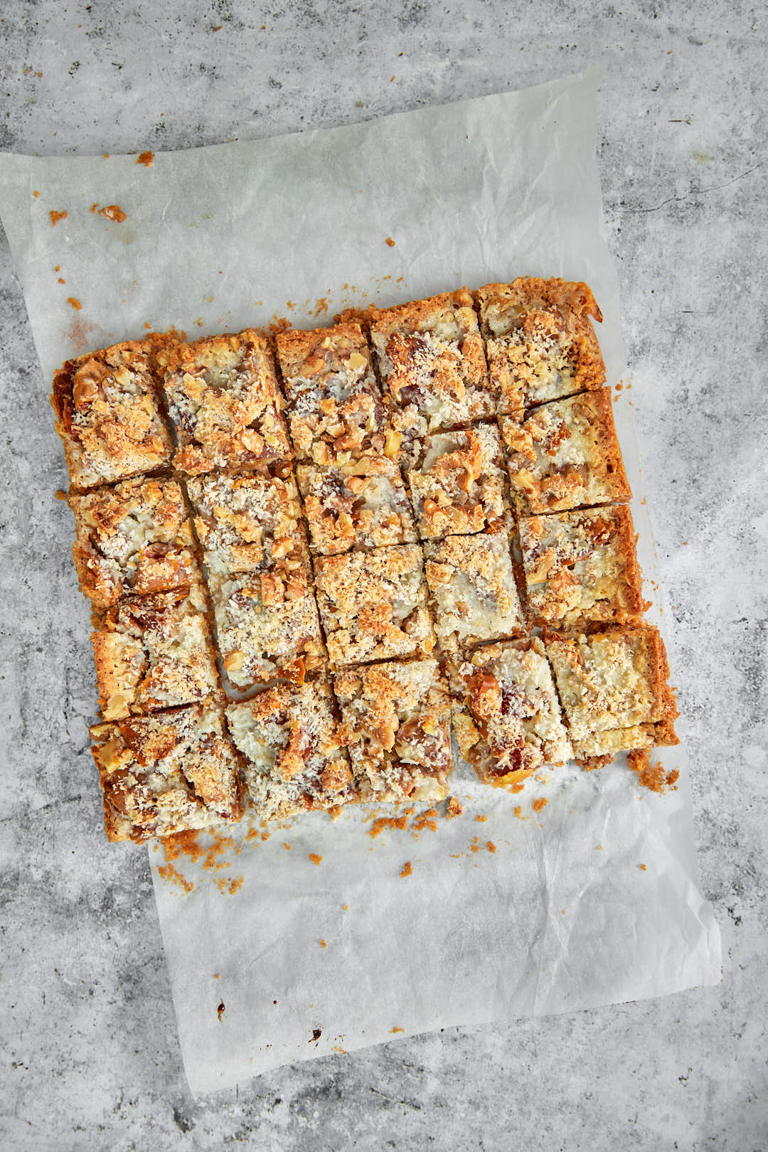 date coconut bars cut into squares after baking.