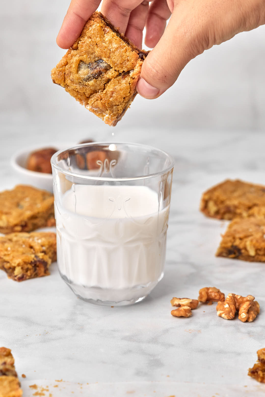 blondie being dunked into a glass of milk.