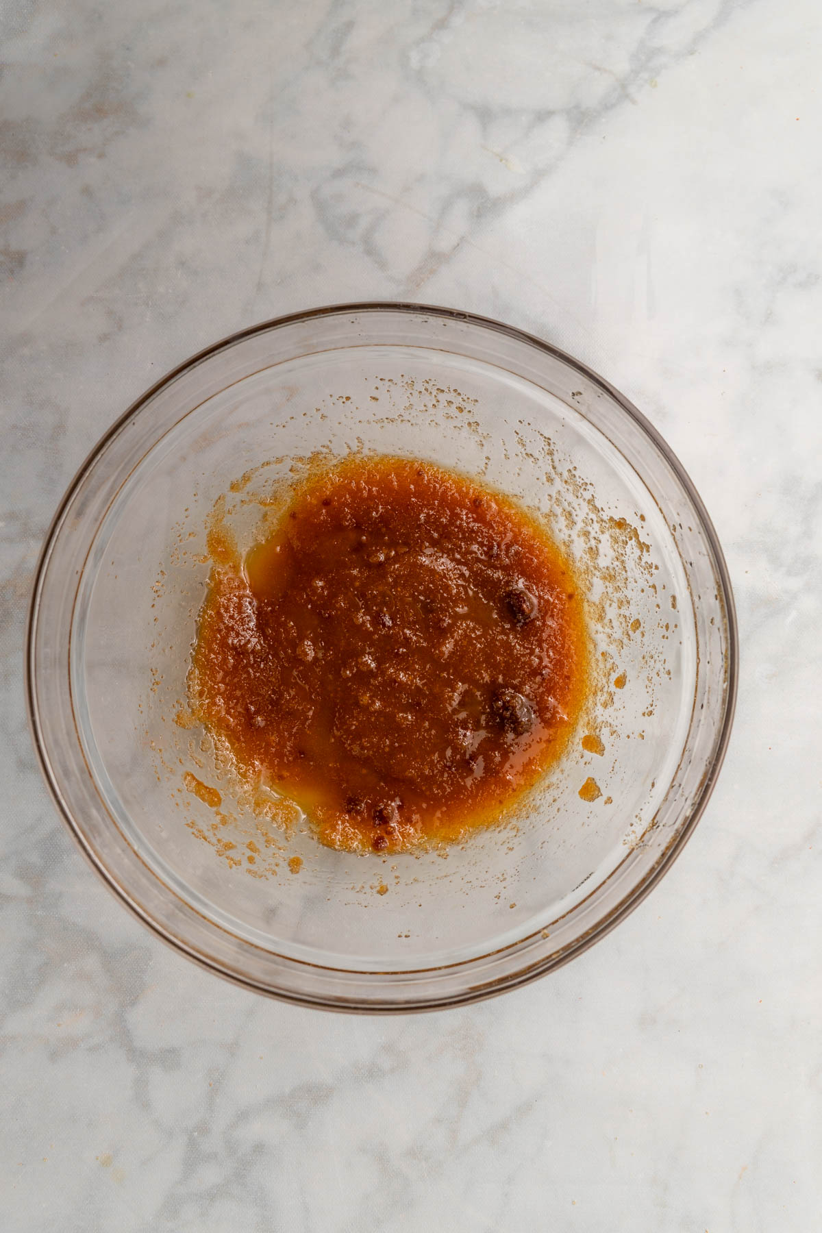 melted butter and brown sugar in a glass bowl.