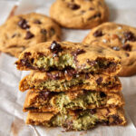 stack of dubai chocolate cookies with pistachio kunafa filling in the middle.