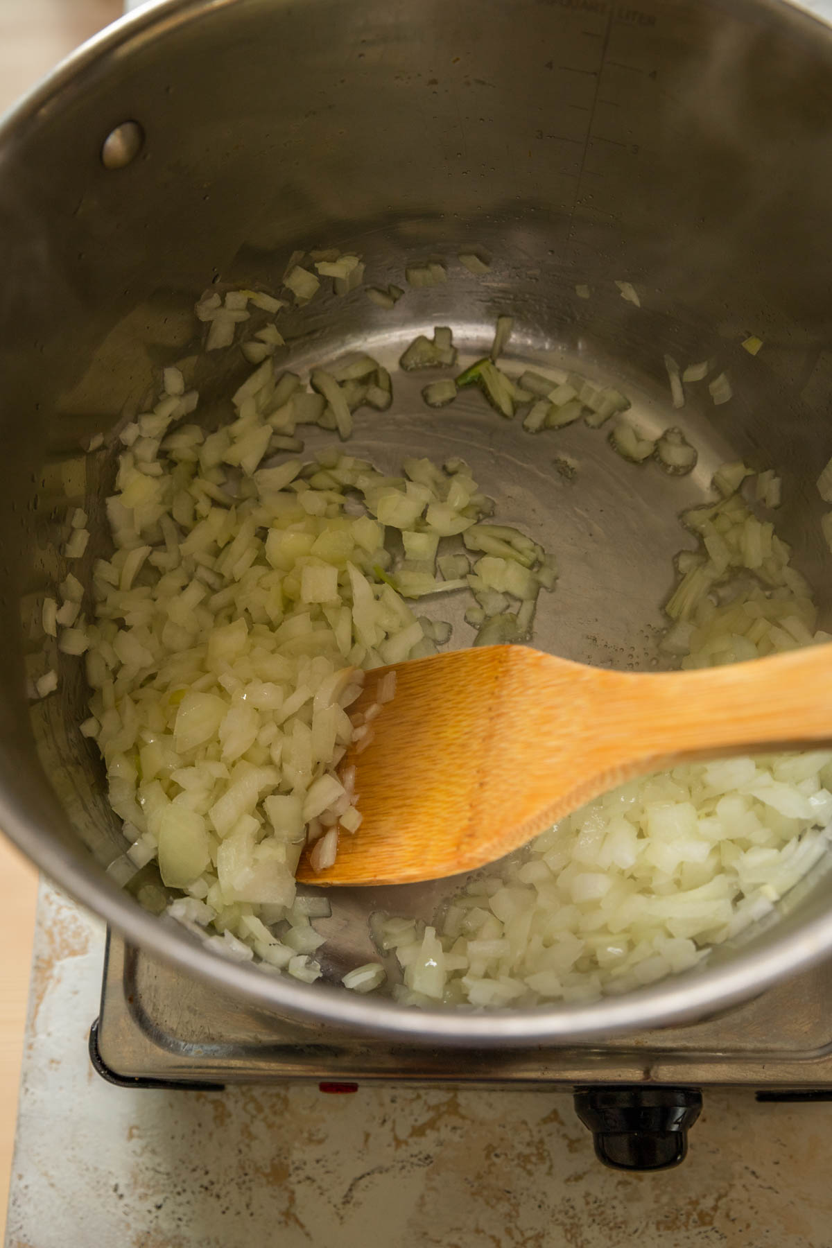 Onions sauteeing in a pan.