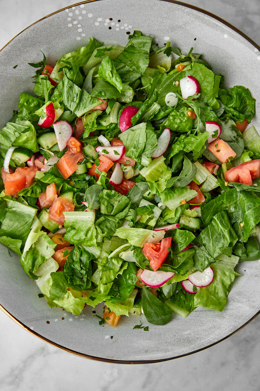 fattouche ingredients mixed into a salad bowl.